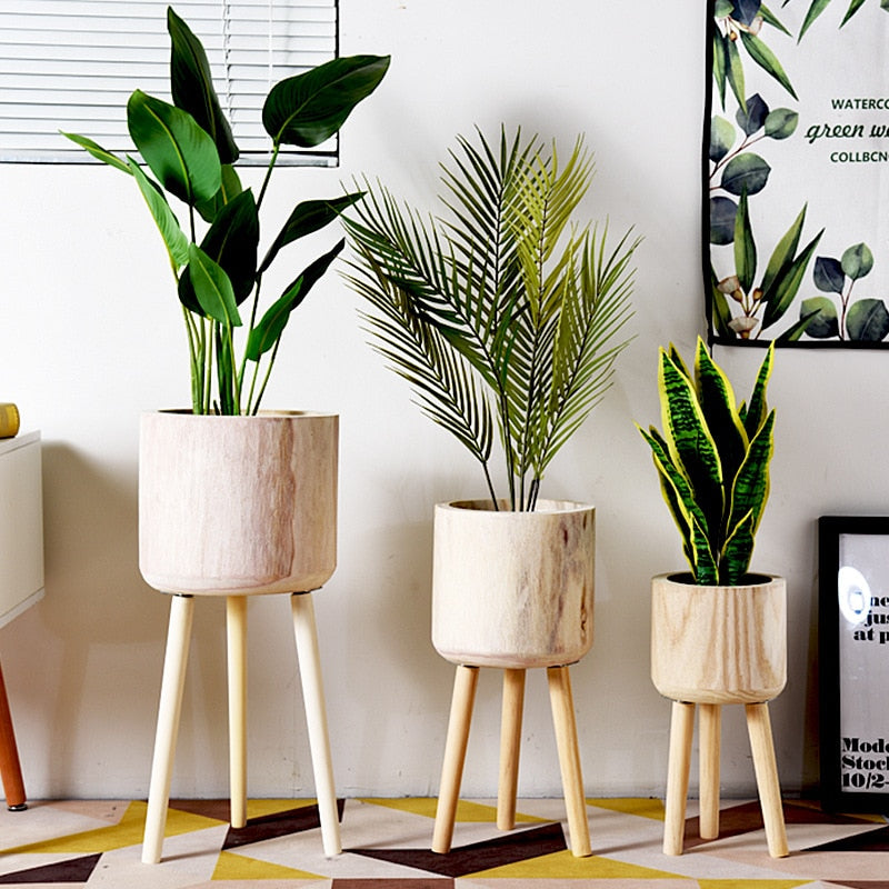 This A Bamboo Floor Planter from Earth to Daisy is perfect for the modern plant mom in her indoor jungle! #plantsmakepeoplehappy