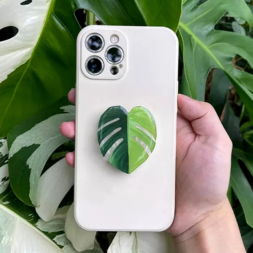 This Foliage Phone Holder | Monstera from Earth to Daisy is perfect for the modern plant mom in her indoor jungle! #plantsmakepeoplehappy