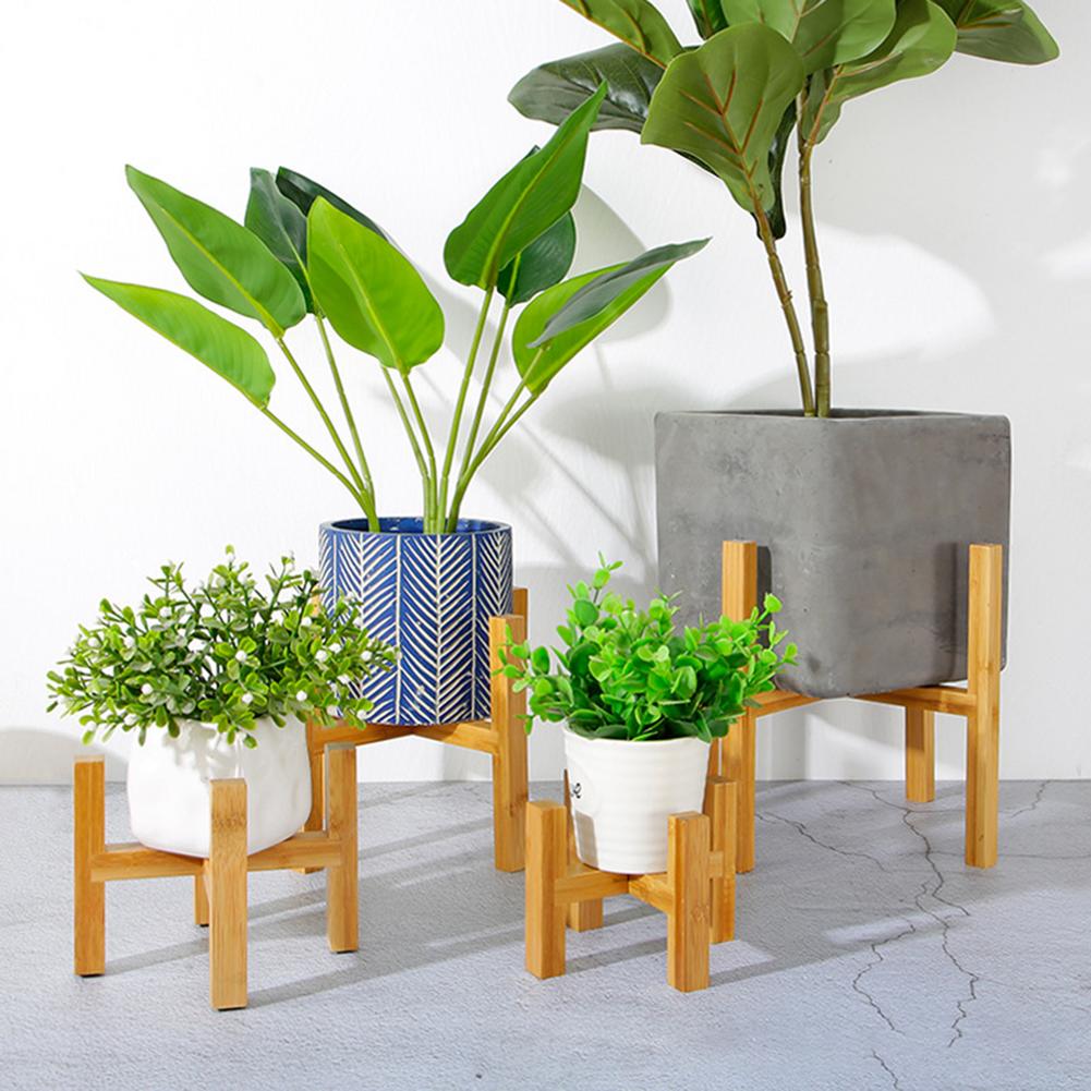 This A Bamboo Plant Stand from Earth to Daisy is perfect for the modern plant mom in her indoor jungle! #plantsmakepeoplehappy
