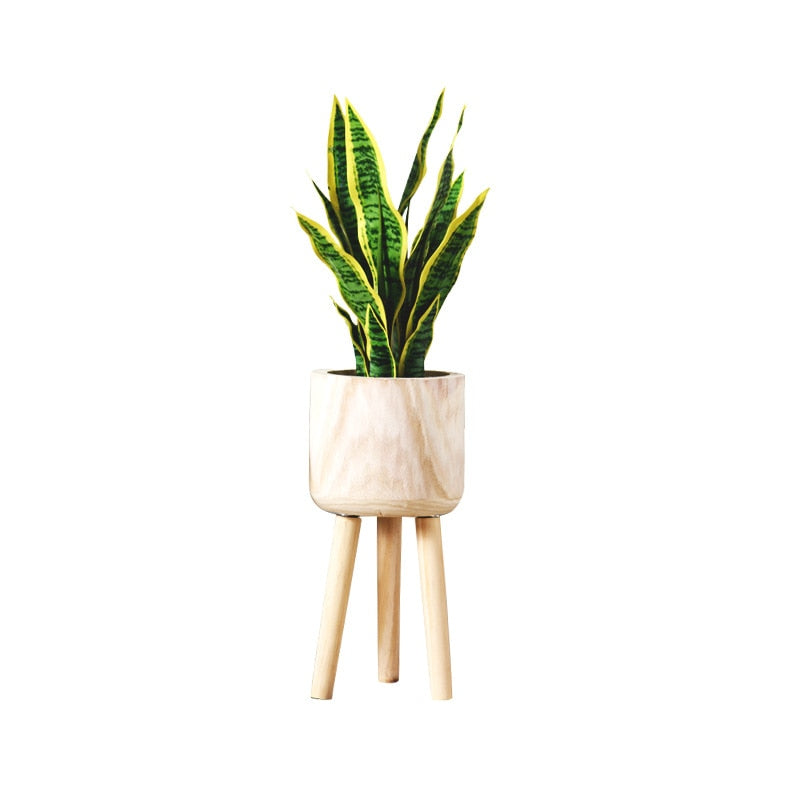 This A Bamboo Floor Planter from Earth to Daisy is perfect for the modern plant mom in her indoor jungle! #plantsmakepeoplehappy