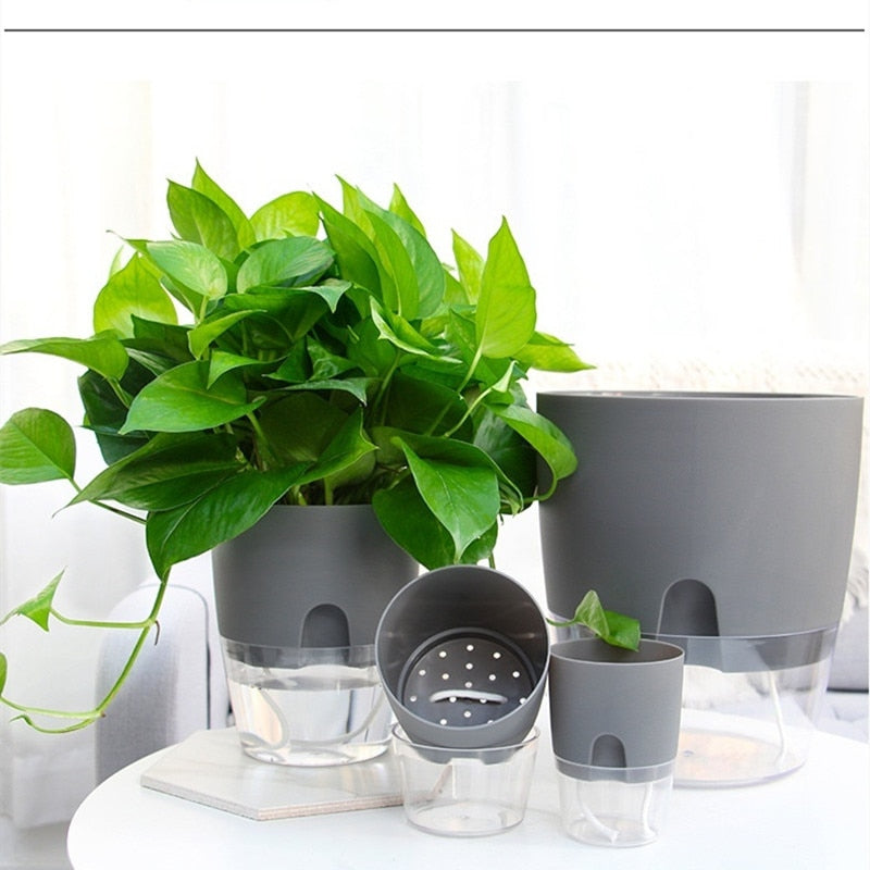 This Grey Semi-Hydro Pots from Earth to Daisy is perfect for the modern plant mom in her indoor jungle! #plantsmakepeoplehappy