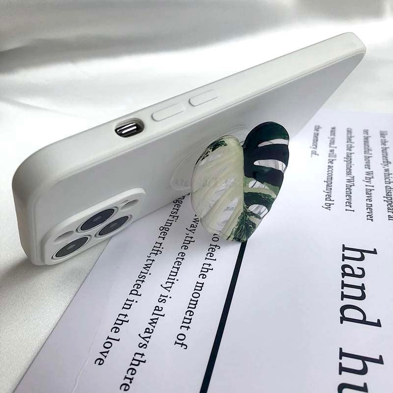 This Foliage Phone Holder | Monstera from Earth to Daisy is perfect for the modern plant mom in her indoor jungle! #plantsmakepeoplehappy